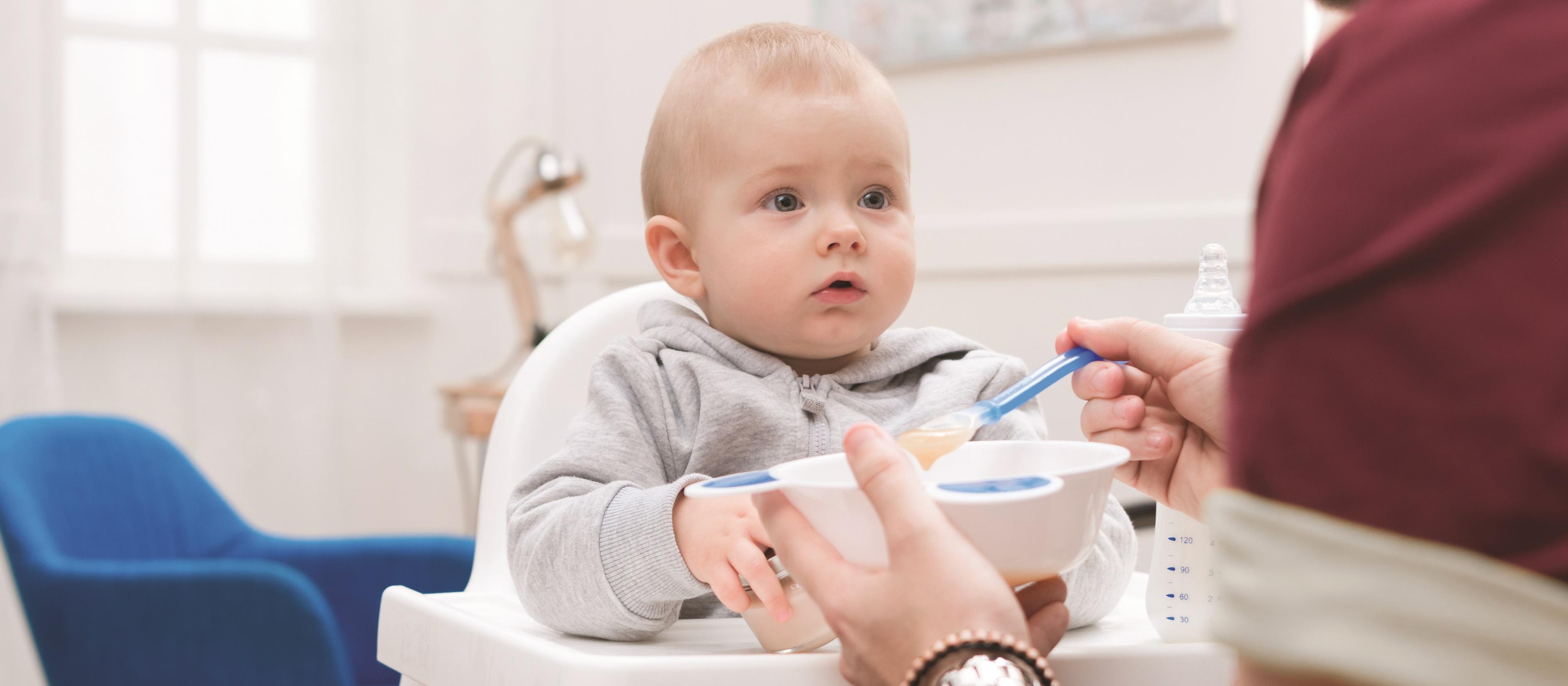 Father feeds baby