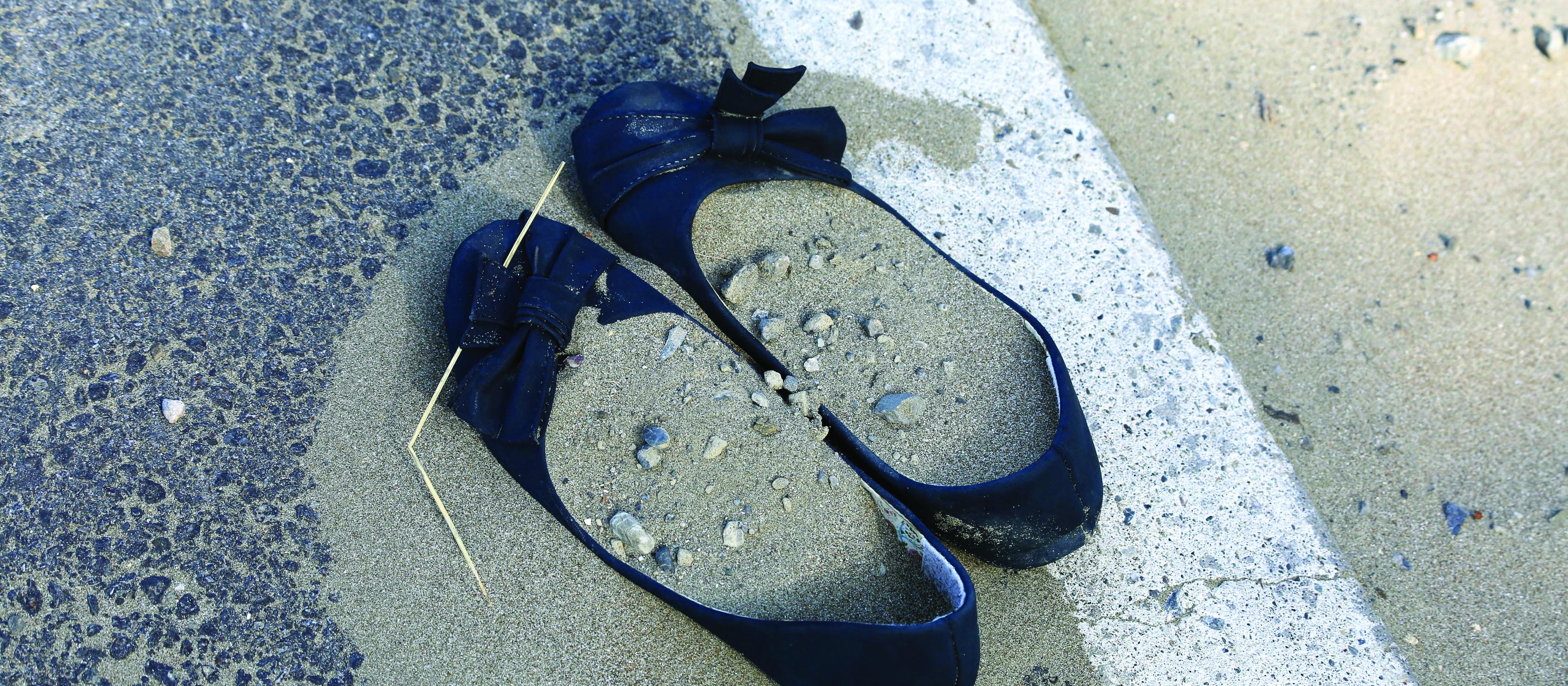 abandoned shoes, sand