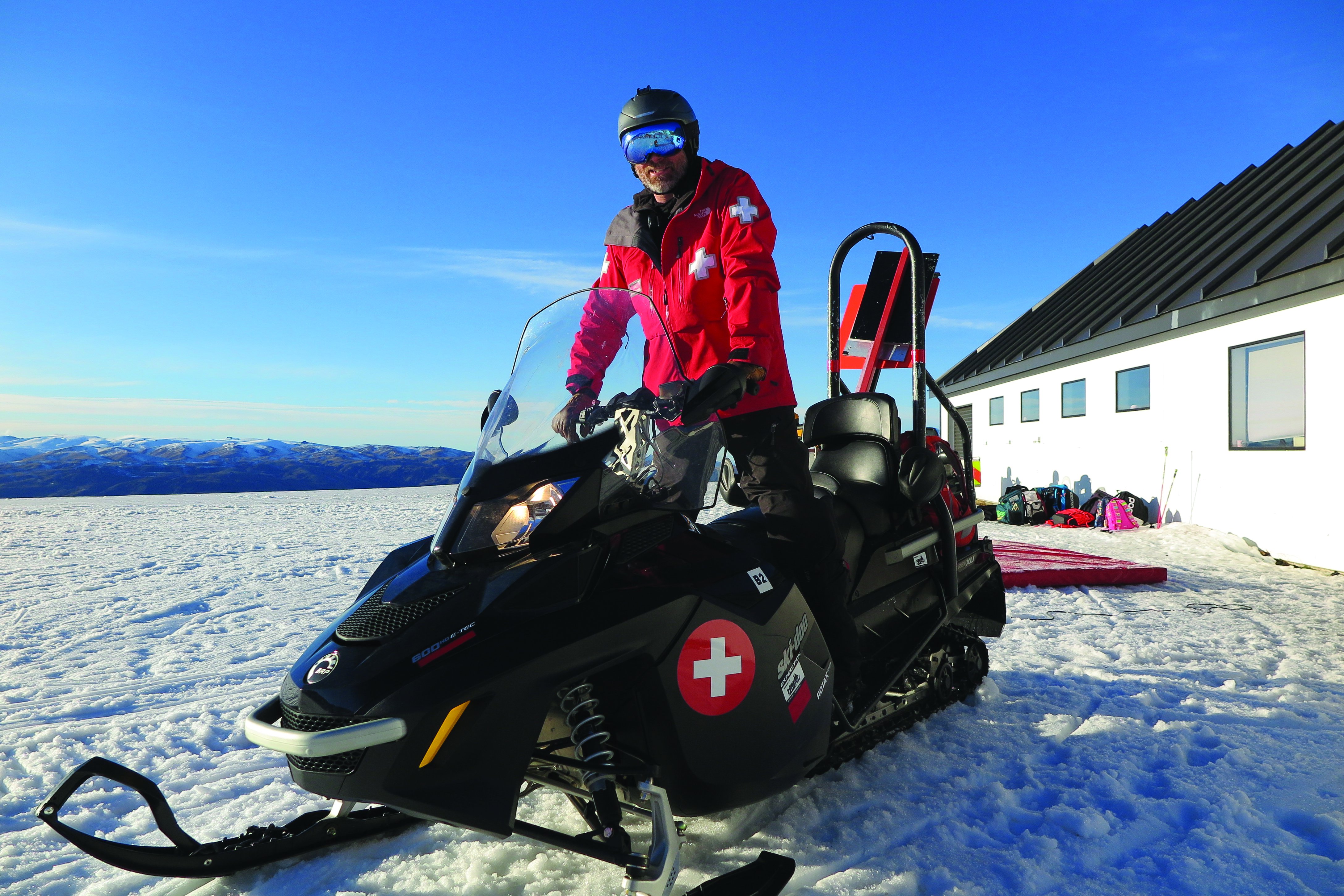 Ski patroller on a skidoo