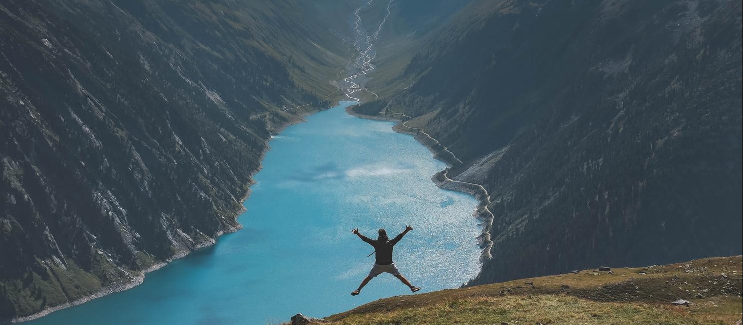 Person jumping in wilderness