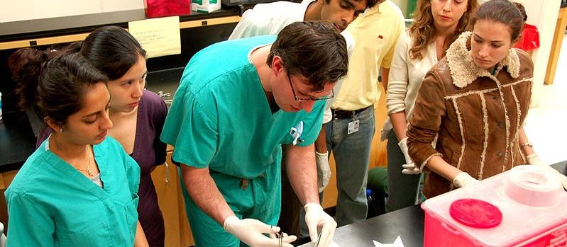 Medical students learning suturing