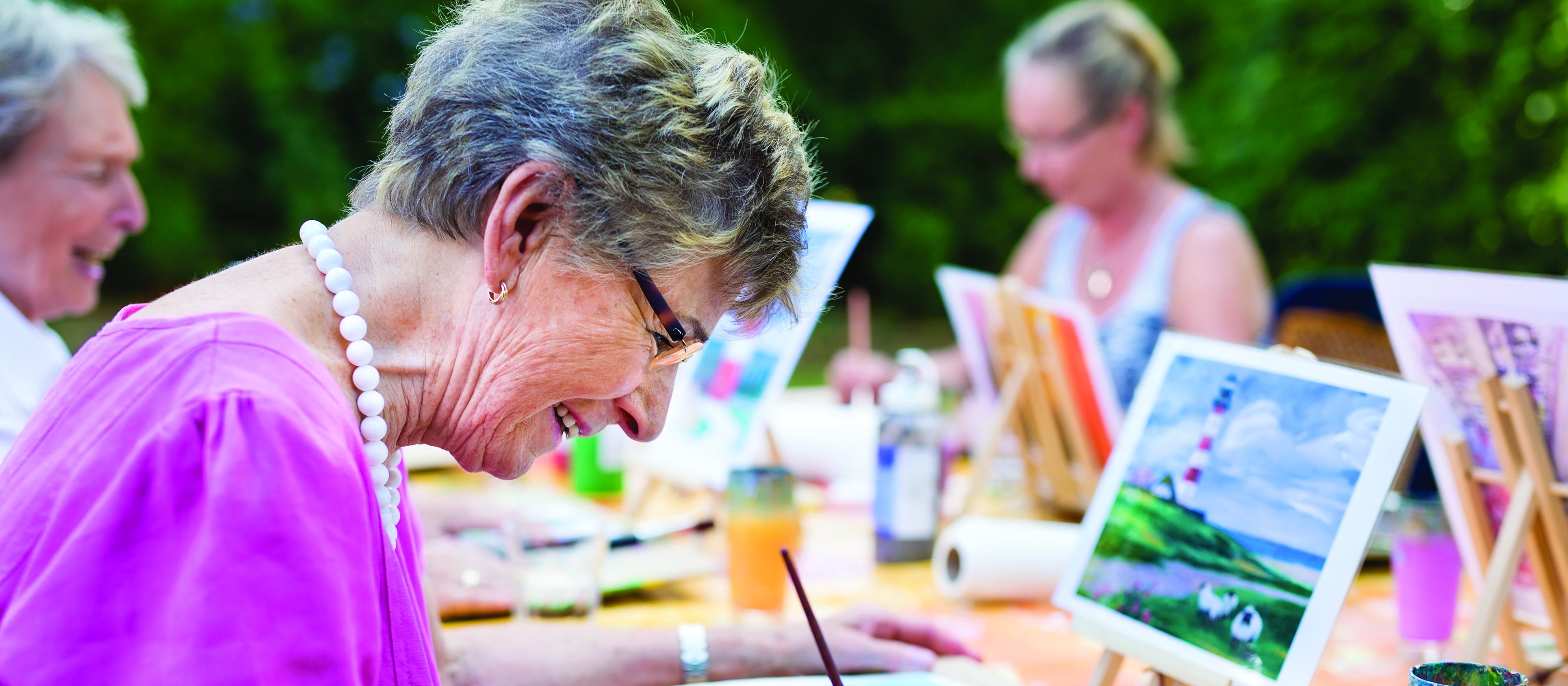 Older woman, older woman painting