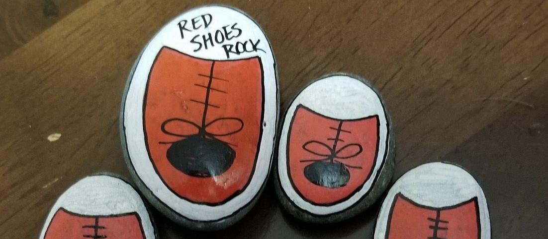 Red shoes on rocks