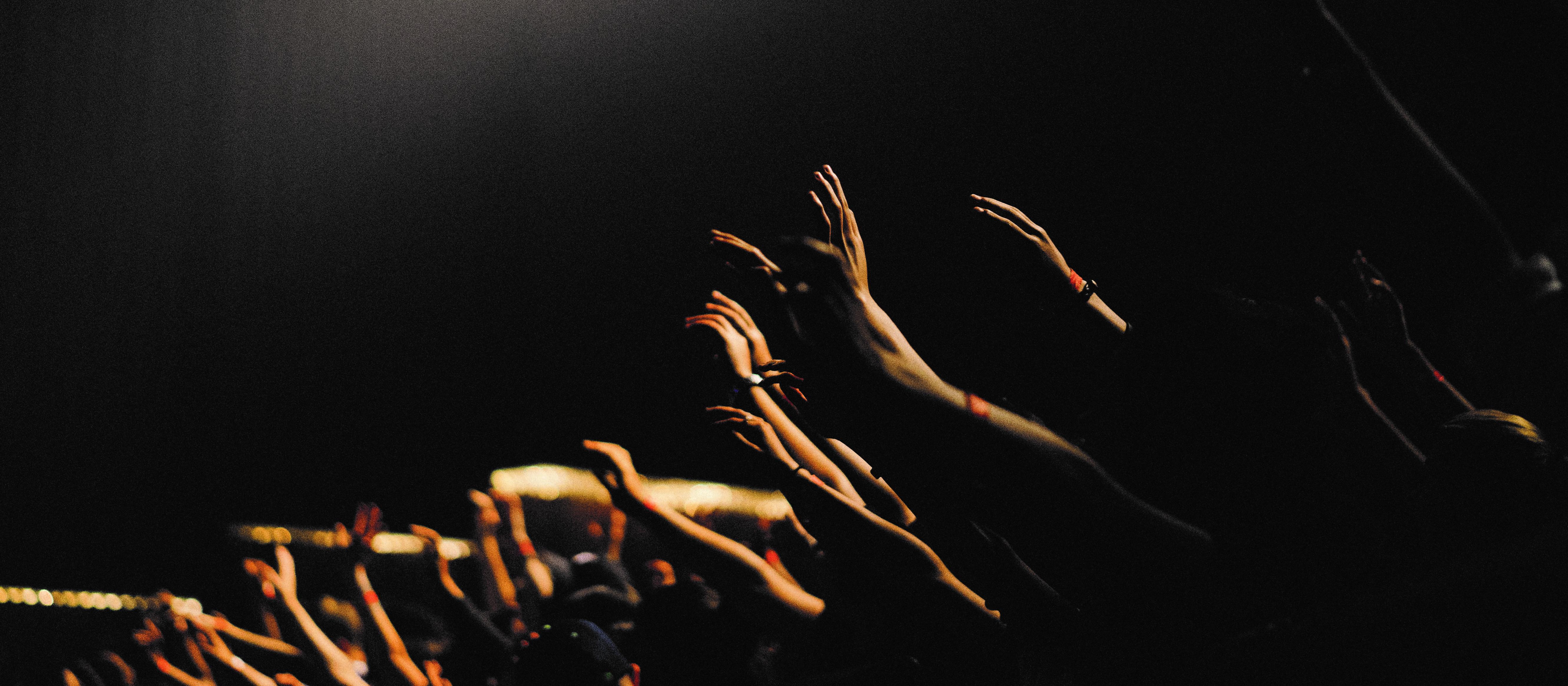 Hands raised, Edwin Andrade on Unsplash