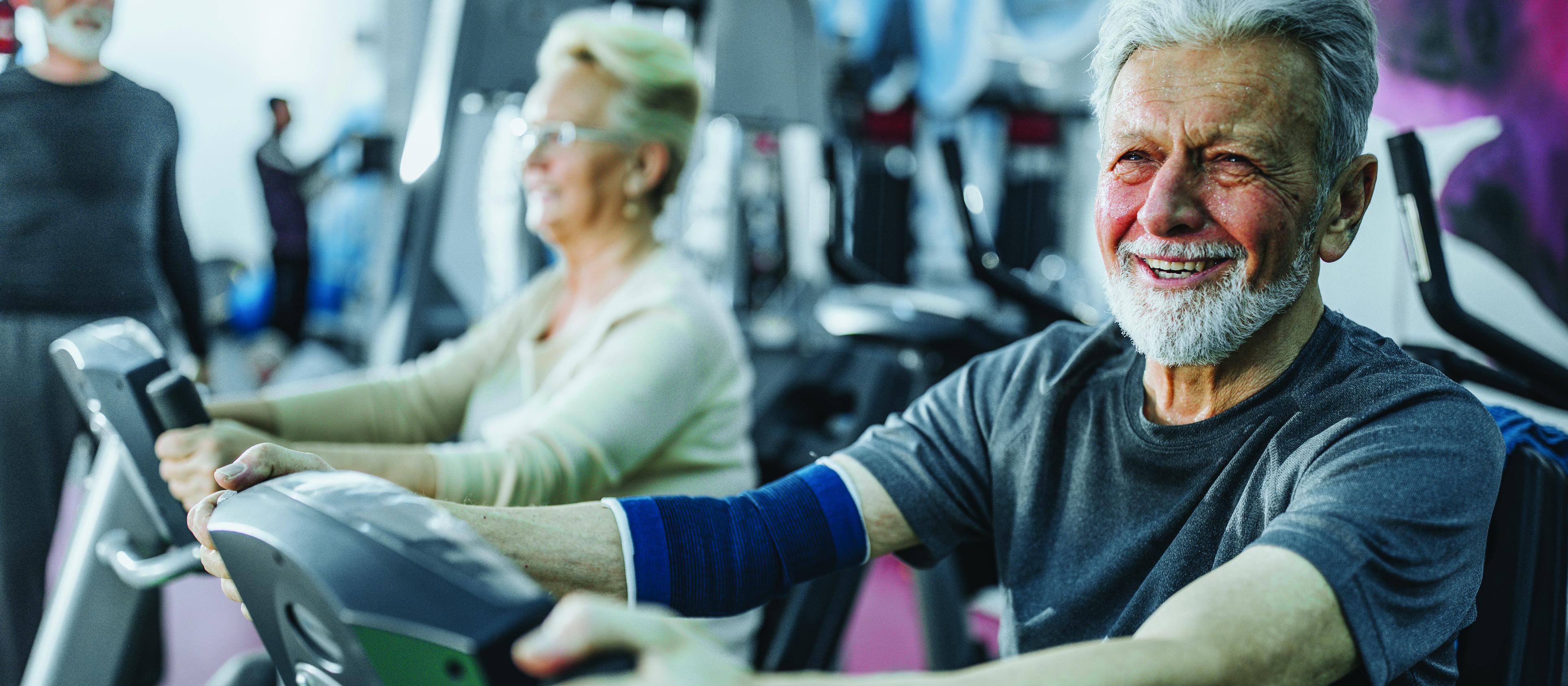 Older man exercising, exercise bike, elder health