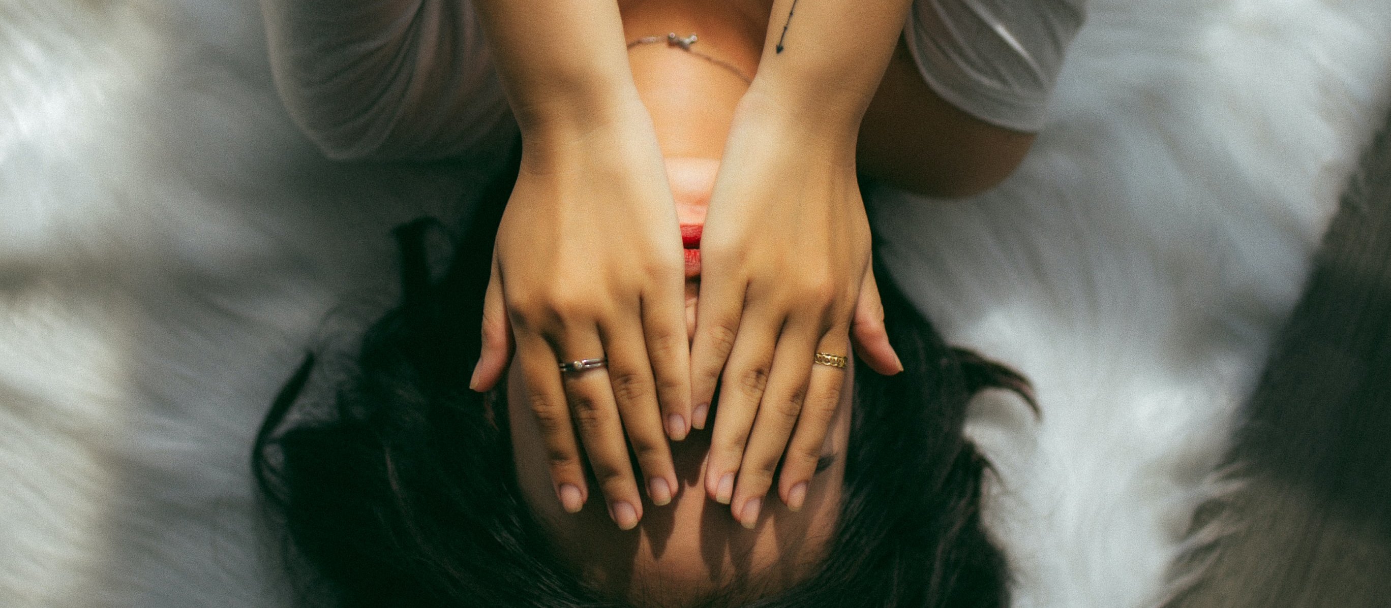 Woman covering face by Anthony Tran on Unsplash