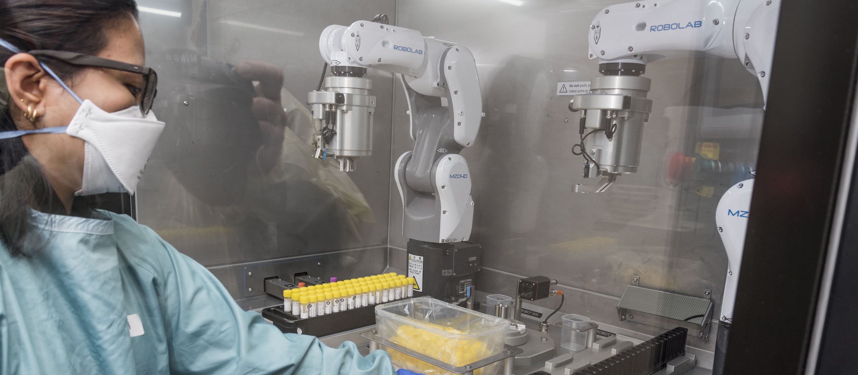 Canterbury Health Laboratories worker using the De-Capping Robot