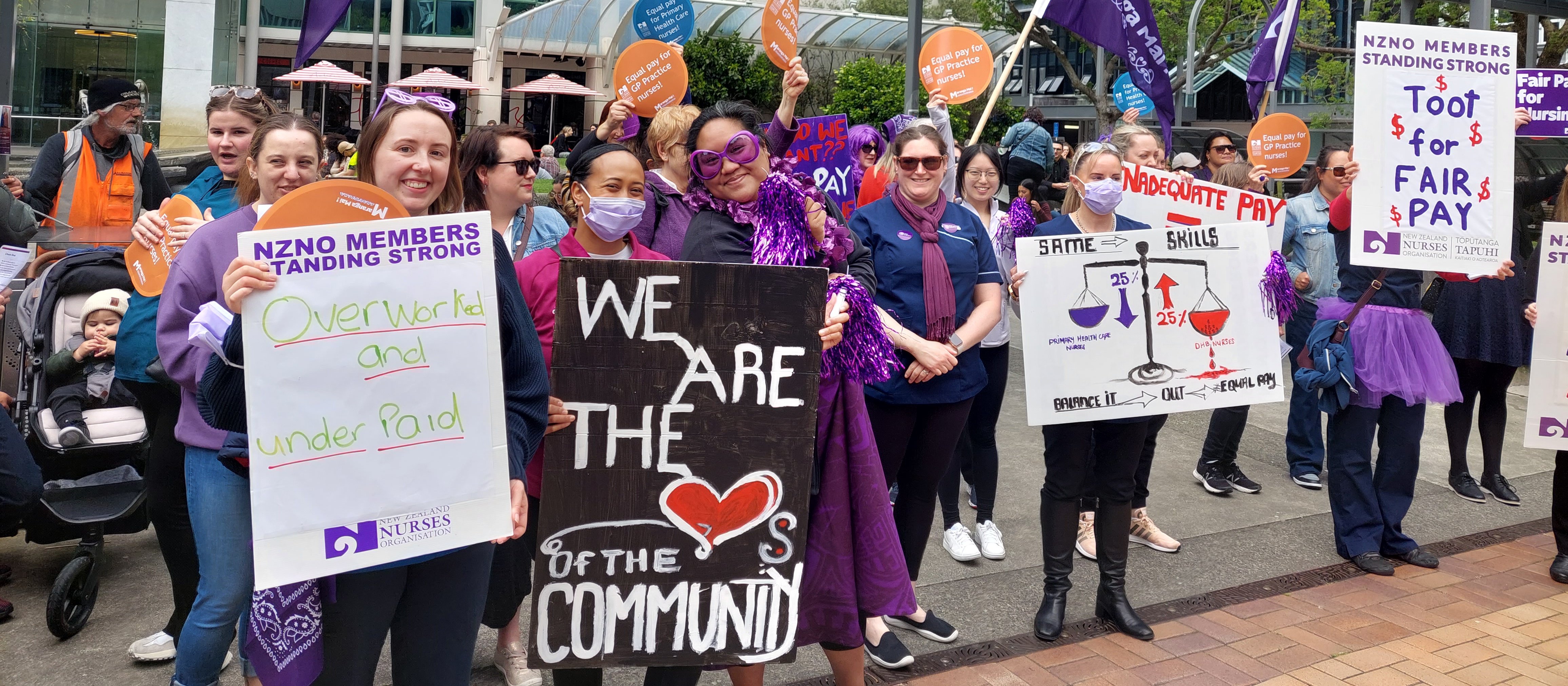 Striking practice and Plunket nurses seeking toots from Lambton Quay motorists after rallying at Wellington’s Midland Park to express their frustration at the ongoing pay gap