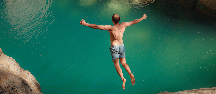 man cliff diving CR Santiaga on iStock