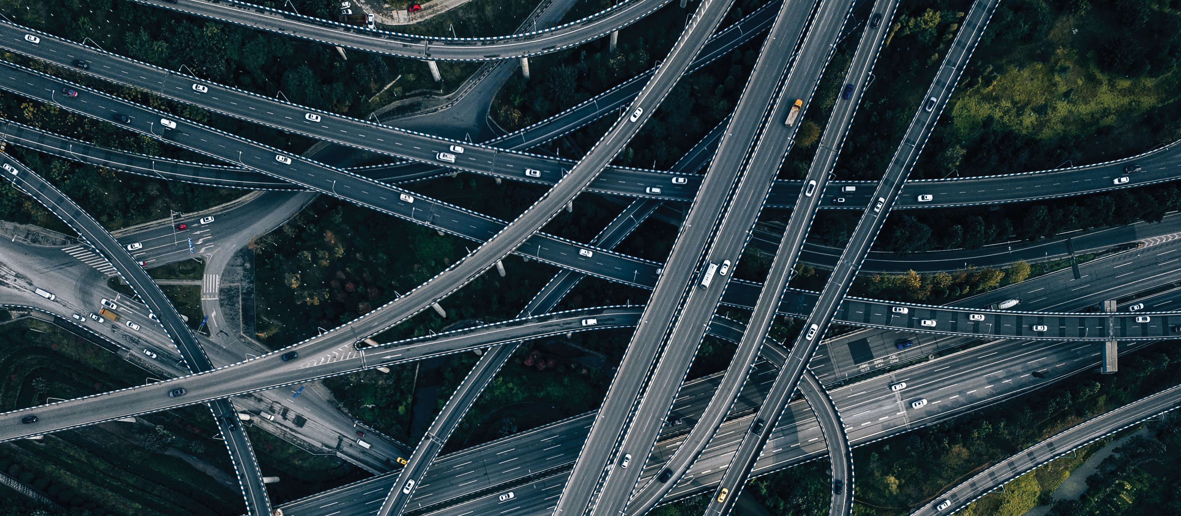 Aerial View of Complex Overpass and Busy Traffic [AerialPerspective Works]