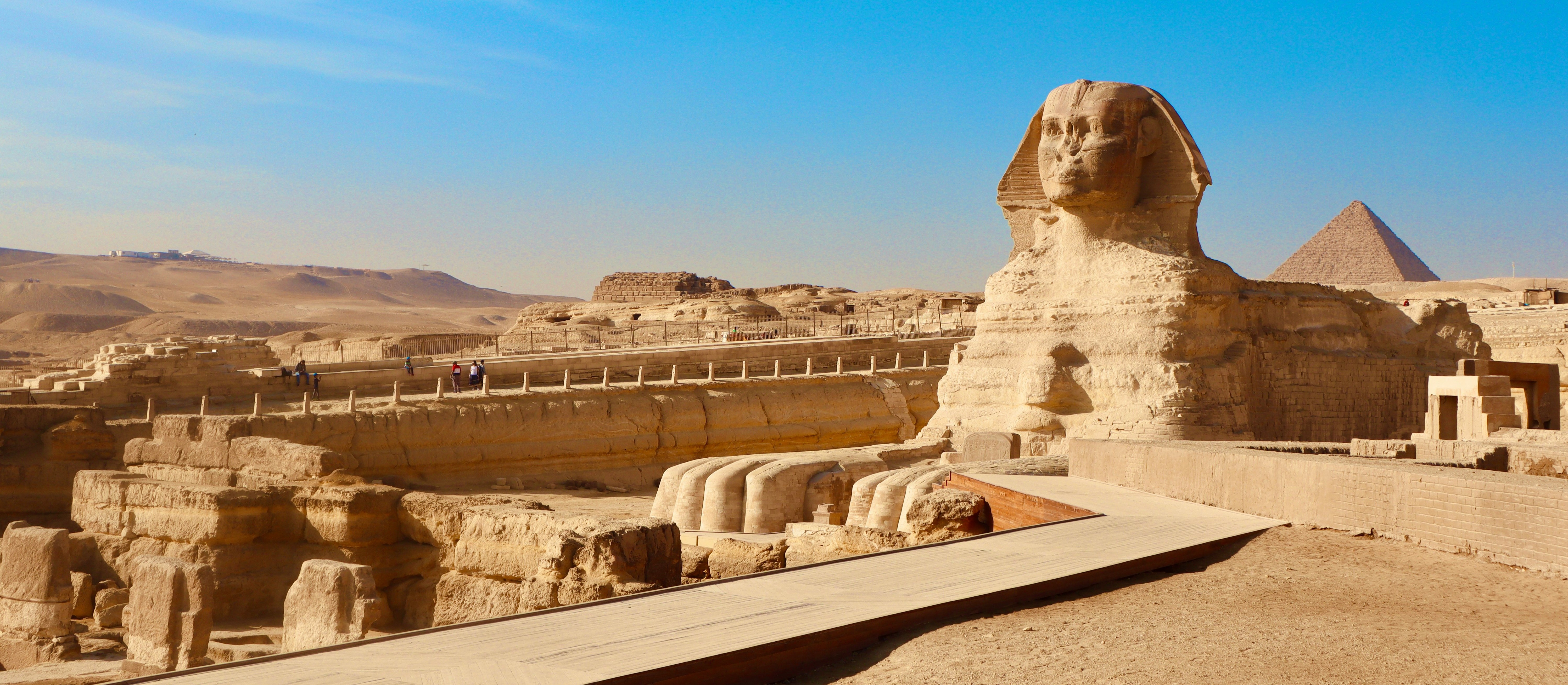 The stone Sphinx of Giza against a blue sky