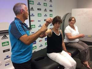 Sports medicine doctor Stephen Kara trains GPs Annie Bradley and Margaret Goodey on MRI referrals