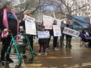 Protesters outside the RNZCGP conference 2018 call for use of surgical mesh to be suspended