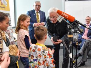 Donor Mark Dunajtschik being presented with a gift