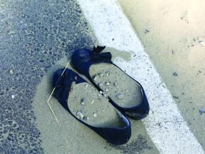 abandoned shoes, sand