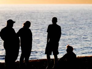 silhouettes on beach