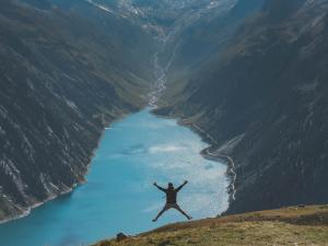 Person jumping in wilderness