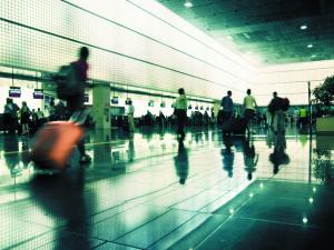 Travellers in busy airport