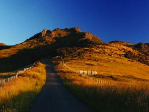 Road leading to hilltop - Martin London