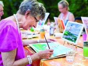 Older woman, older woman painting