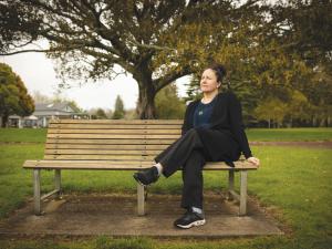 Matire Harwood sitting on a park bench