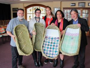 Dr Ruakere Hond, Rachael Peek (Taranaki DHB associate director of Midwifery), Grace Maha (Taranaki DHB midwife and SUDI prevention coordinator), Puhi and Philip Nuku (local weavers)