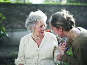 Older woman talking with younger woman