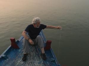 Marc Shaw pouring source water into the mouth of the Ganges