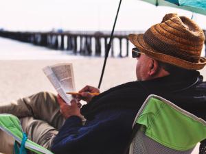 Older male on beach, Tim Mossholder on Unsplash