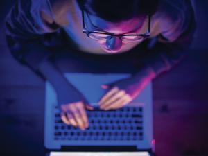 Guy at a computer screen_iStock