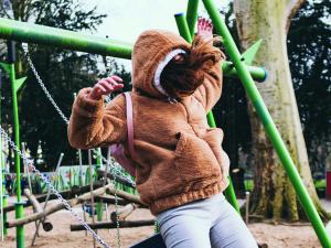 Girl on swing, by NS on Unsplash