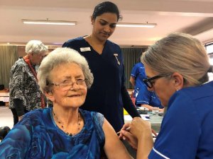 Evelyn Bennett is vaccinated by Tarankai DHB's Cheryl Jackson