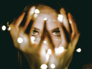 Lady holding lights_Rhett Wesley on Unsplash