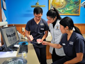 West Coast IPE students, dental and pharmacy. Jason Yoo, Vivienne Lin and Caylee Jeon