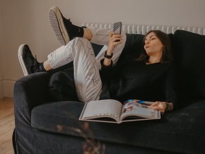 Staying at home, Self-isolation, Girl sitting on a couch_ Toa Heftiba on Unsplash