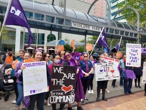 Striking practice and Plunket nurses seeking toots from Lambton Quay motorists after rallying at Wellington’s Midland Park to express their frustration at the ongoing pay gap