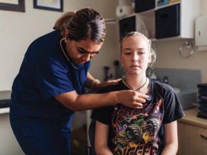 Specialist GP Dr Vanisi Prescott (Tongan) with patient.jpeg 