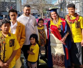 Uinita (Nita) Tapa'atoutai surrounded by her family celebrating an earlier study milestone 