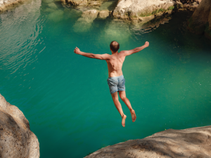 man cliff diving CR Santiaga on iStock