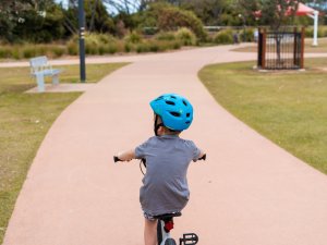 Child on bike [Image: Kelli McClintock on Unsplash]