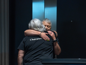 Departing PMAANZ chair Michelle Te Kira being hugged by incoming chair Mary Morrissey_KeepaDigital