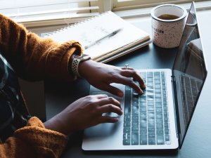 Woman on laptop [Daniel Thomas on Unsplash]