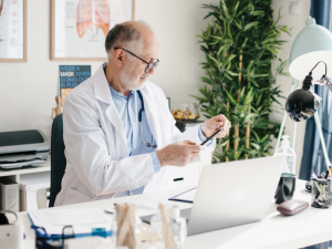 GP at desk CR Anchiy on iStock