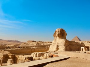 The stone Sphinx of Giza against a blue sky