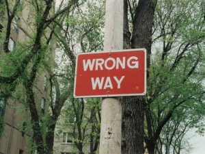 Wrong way sign CR Randy Laybourne on Unsplash