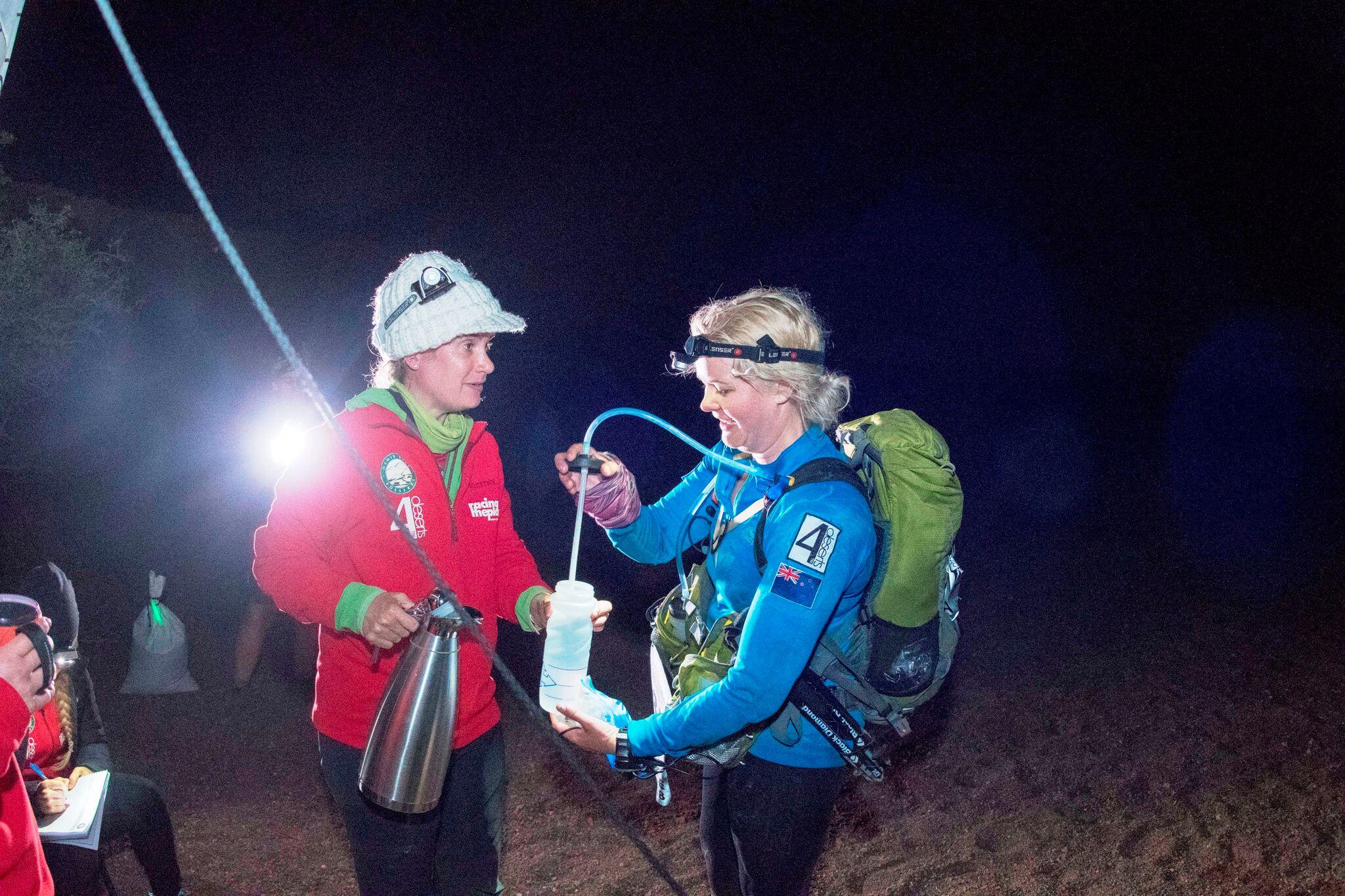 Ruth Upsdell tops up her fluids at a checkpoint